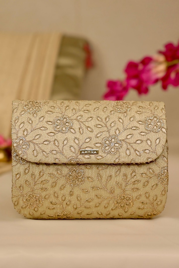 Light Gold Tissue Cutwork & Zari Thread Embroidered Flapover Bag by AMYRA at Pernia's Pop Up Shop