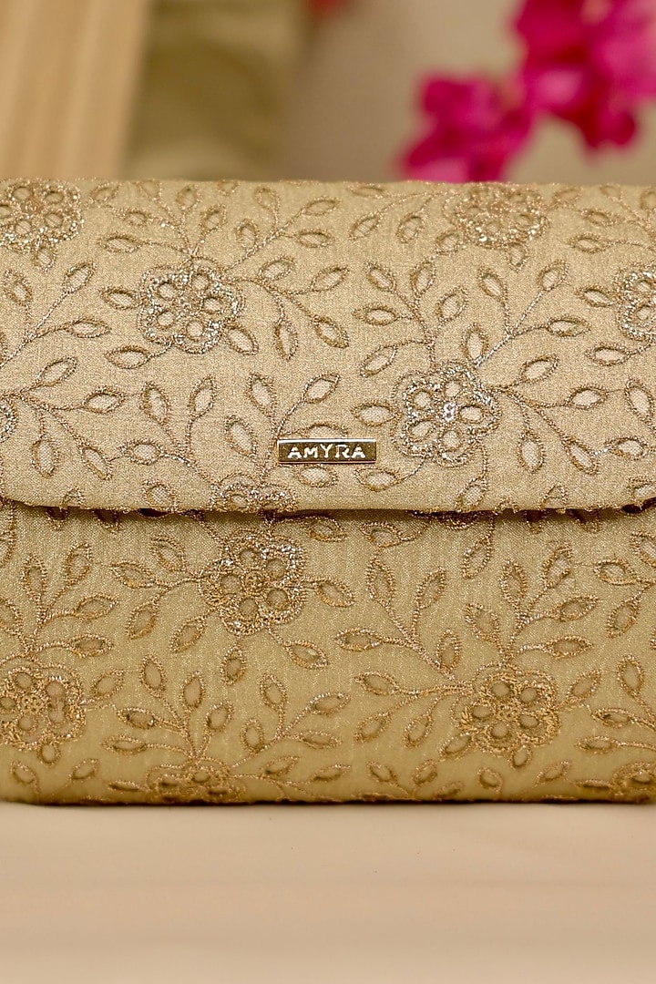 Light Gold Tissue Cutwork & Zari Thread Embroidered Flapover Bag by AMYRA at Pernia's Pop Up Shop