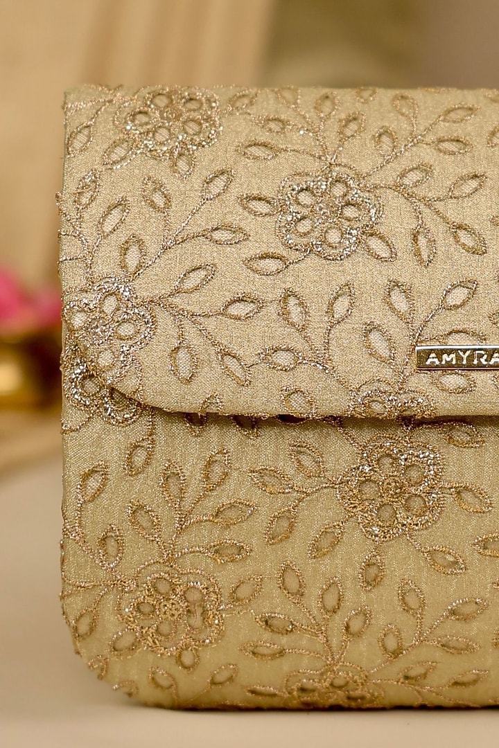 Light Gold Tissue Cutwork & Zari Thread Embroidered Flapover Bag by AMYRA at Pernia's Pop Up Shop