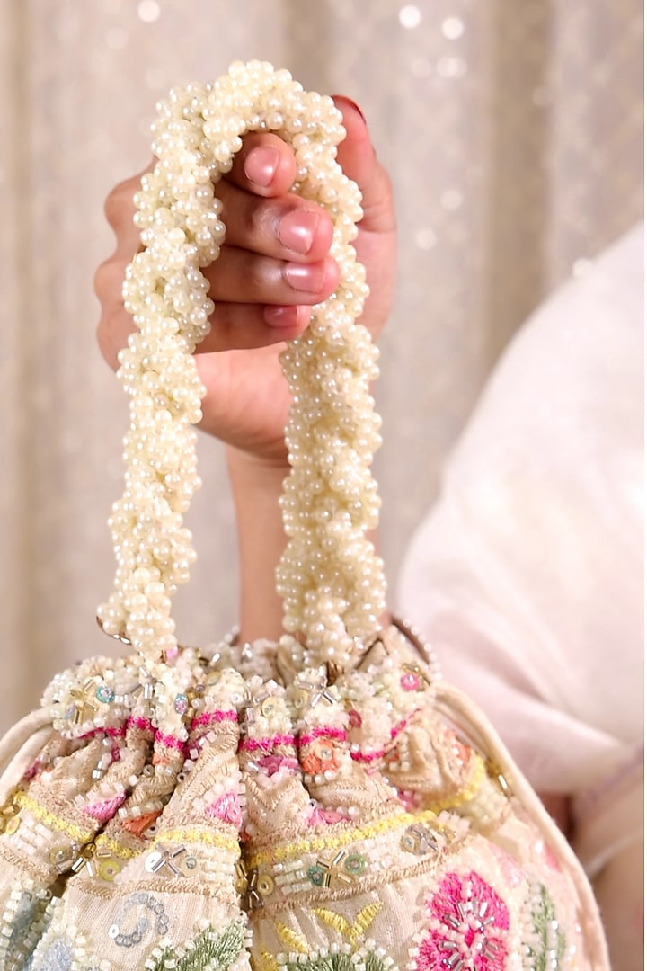 Multi-Colored Poly Silk Floral Embellished Handcrafted Potli Bag by AMYRA at Pernia's Pop Up Shop