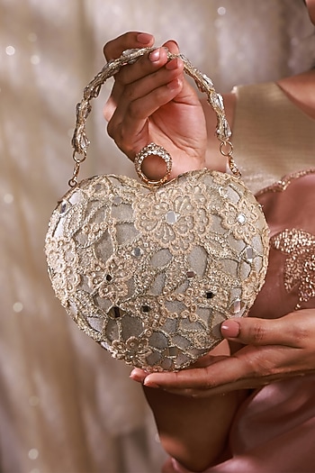 Gold Tissue Mirror Embroidered Heart Potli Bag by AMYRA at Pernia's Pop Up Shop