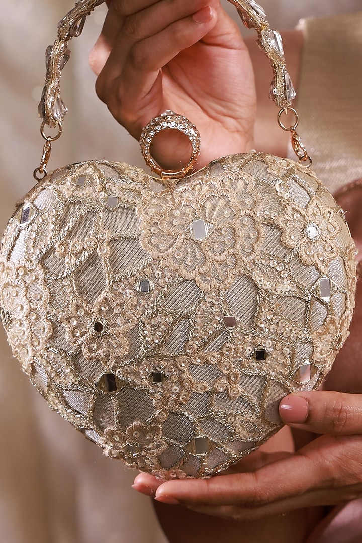 Gold Tissue Mirror Embroidered Heart Potli Bag by AMYRA at Pernia's Pop Up Shop