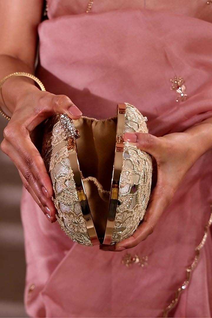 Gold Tissue Mirror Embroidered Heart Potli Bag by AMYRA at Pernia's Pop Up Shop