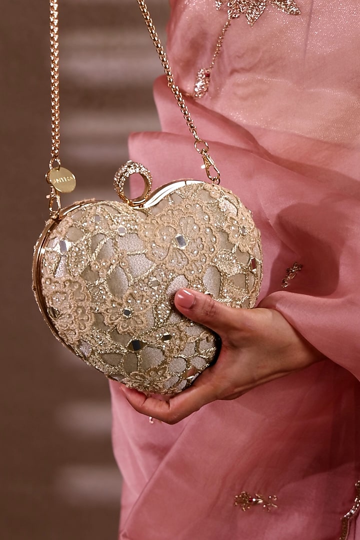 Gold Tissue Mirror Embroidered Heart Potli Bag by AMYRA at Pernia's Pop Up Shop