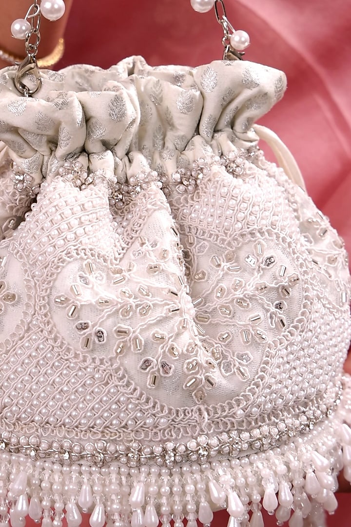 Silver Poly Silk Pearl Hand Embroidered Potli Bag by AMYRA at Pernia's Pop Up Shop