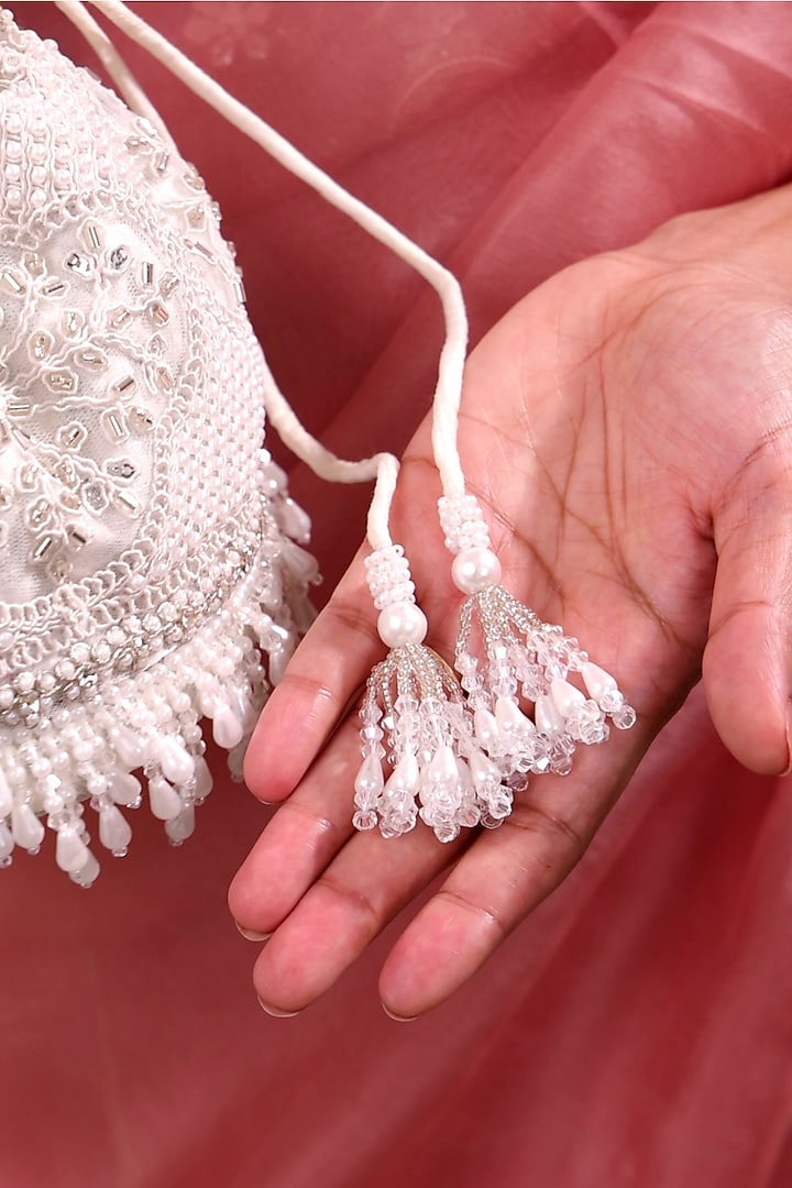 Silver Poly Silk Pearl Hand Embroidered Potli Bag by AMYRA at Pernia's Pop Up Shop
