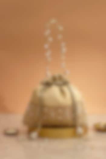 Cream Poly Silk Brocade Cutdana Law Embellished Potli by AMYRA at Pernia's Pop Up Shop