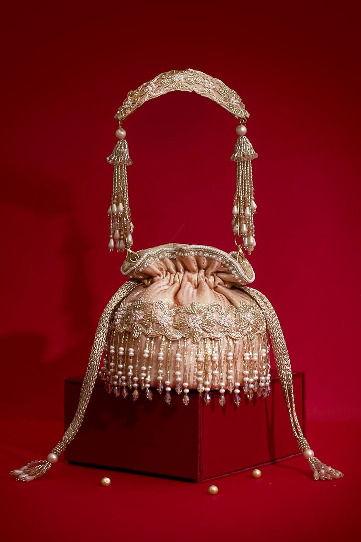 Pink Silk Organza Cutdana Hand Embroidered Mini Potli by AMYRA at Pernia's Pop Up Shop