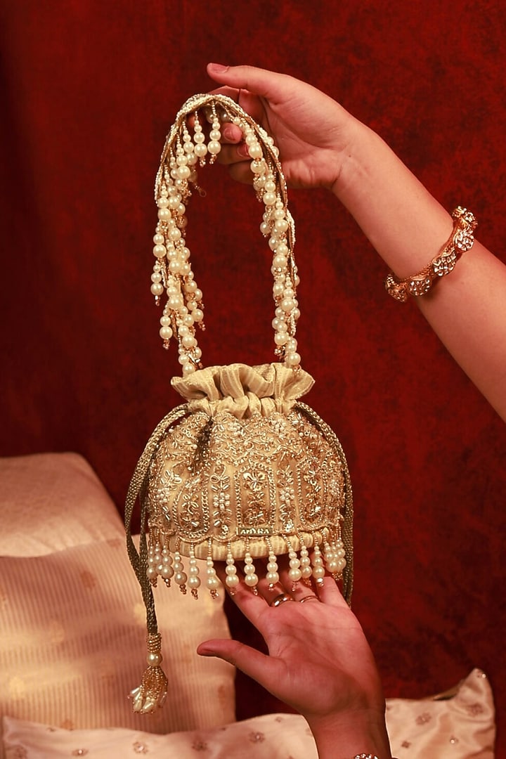 Gold Poly Silk Brocade Cutdana Lace Work Mini Potli by AMYRA at Pernia's Pop Up Shop