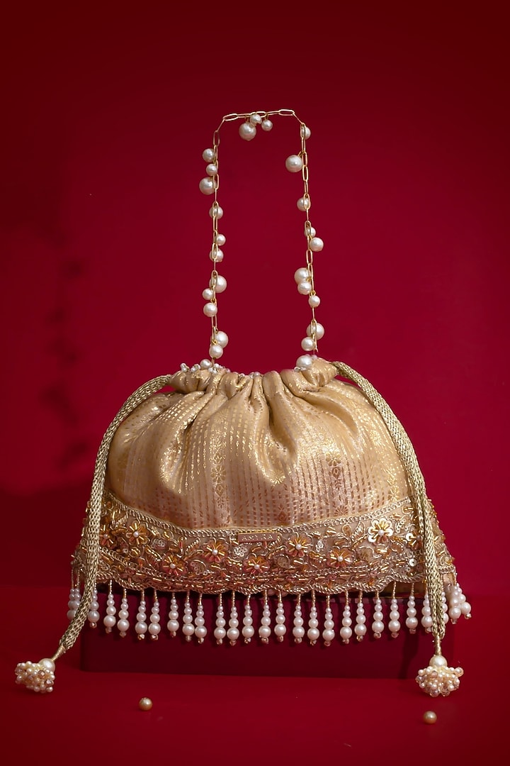 Beige Silk Organza Cutdana Lace Embroidered Potli by AMYRA at Pernia's Pop Up Shop