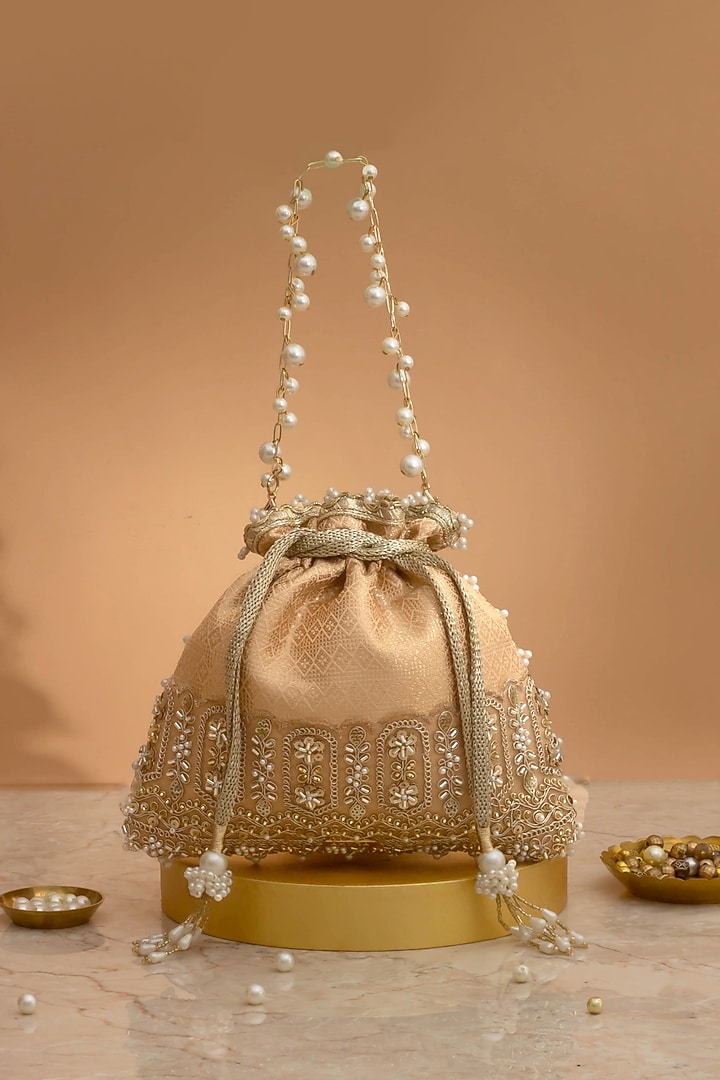 Peach Poly Silk Brocade Cutdana Law Embellished Potli by AMYRA at Pernia's Pop Up Shop