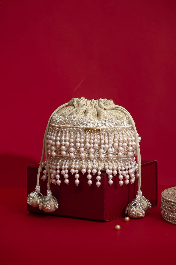 Ivory Tussar Brocade Lace Embellished Minit Potli by AMYRA at Pernia's Pop Up Shop