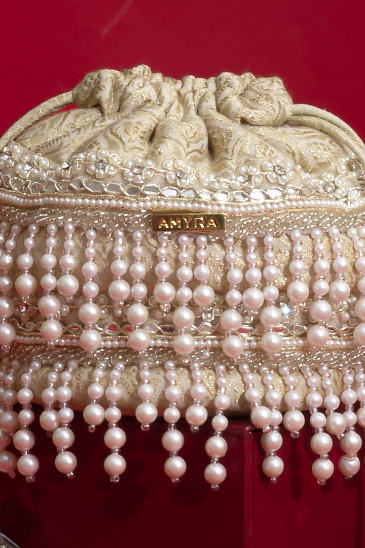 Ivory Tussar Brocade Lace Embellished Minit Potli by AMYRA at Pernia's Pop Up Shop