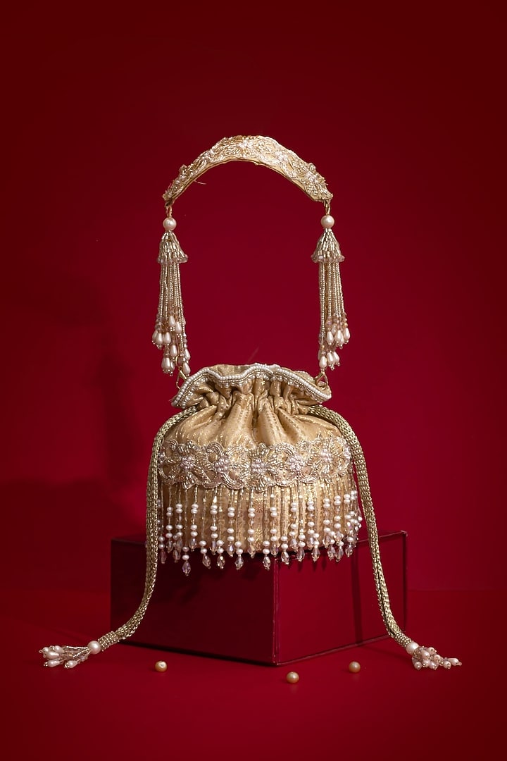 Beige Silk Organza Cutdana Hand Embroidered Mini Potli by AMYRA at Pernia's Pop Up Shop