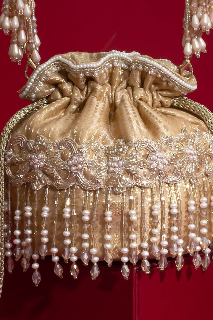 Beige Silk Organza Cutdana Hand Embroidered Mini Potli by AMYRA at Pernia's Pop Up Shop