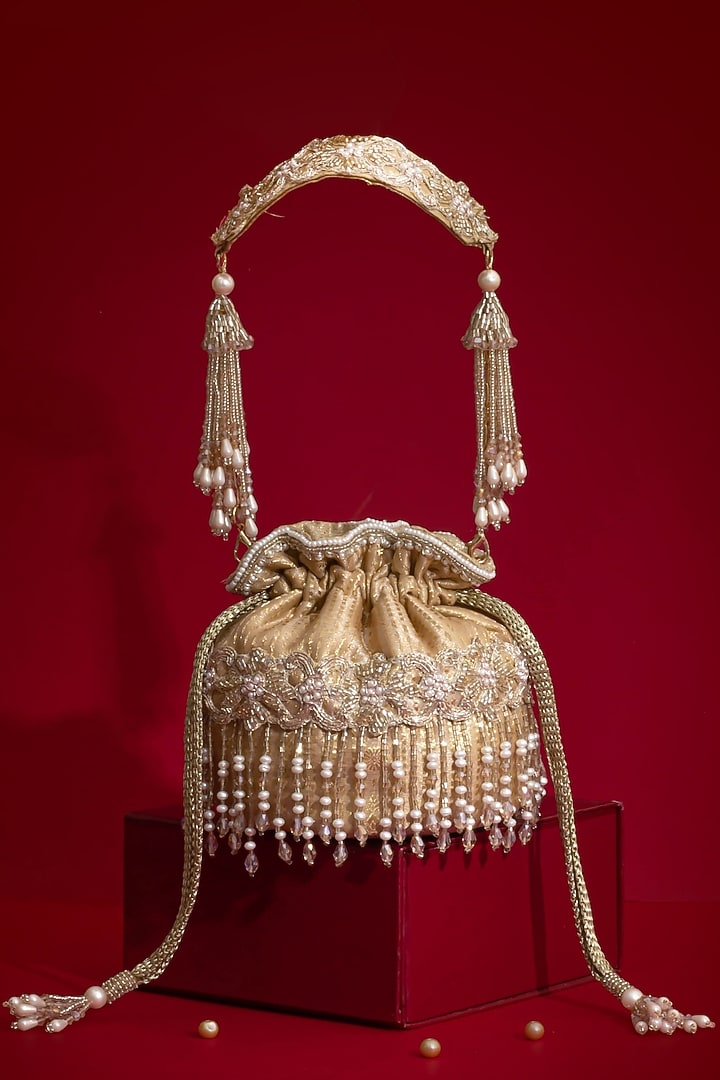 Beige Silk Organza Cutdana Hand Embroidered Mini Potli by AMYRA at Pernia's Pop Up Shop