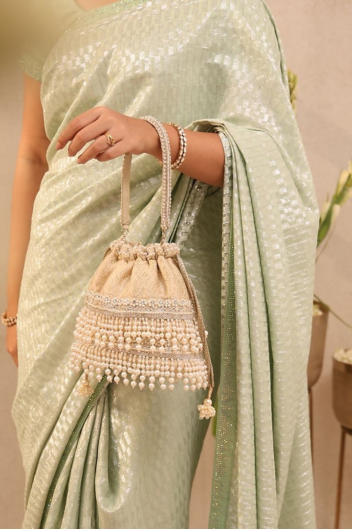 Off-White Tussar Brocade Pearl Embellished Bucket Bag by AMYRA at Pernia's Pop Up Shop