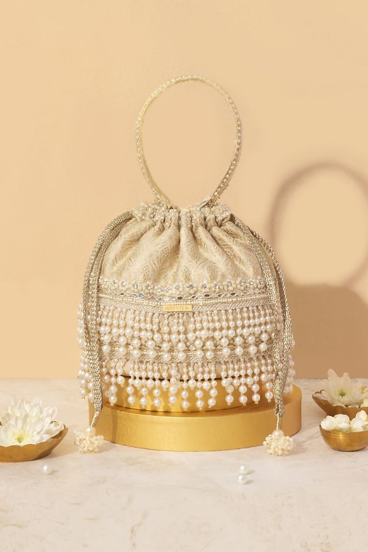 Off-White Tussar Brocade Pearl Embellished Bucket Bag by AMYRA at Pernia's Pop Up Shop