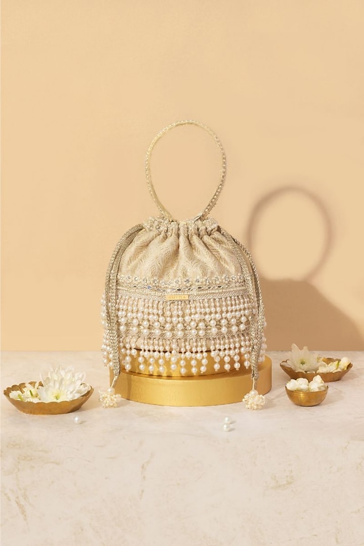 Off-White Tussar Brocade Pearl Embellished Bucket Bag by AMYRA at Pernia's Pop Up Shop