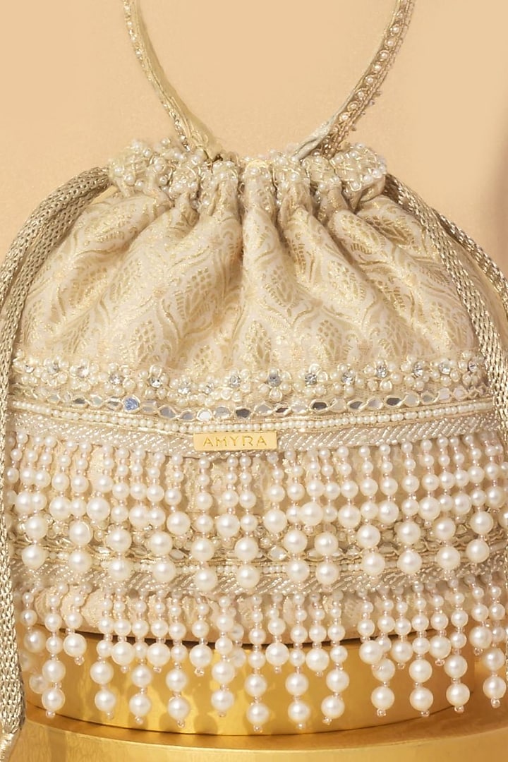 Off-White Tussar Brocade Pearl Embellished Bucket Bag by AMYRA at Pernia's Pop Up Shop