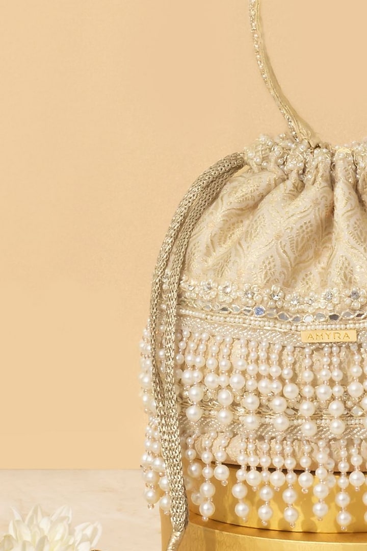 Off-White Tussar Brocade Pearl Embellished Bucket Bag by AMYRA at Pernia's Pop Up Shop