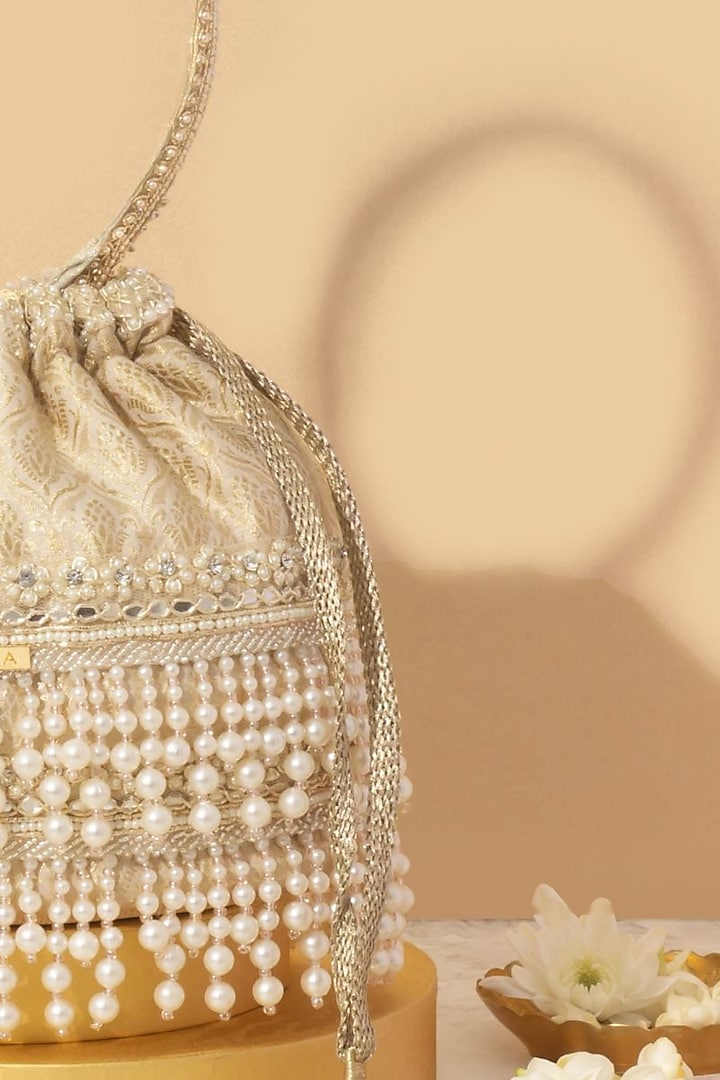 Off-White Tussar Brocade Pearl Embellished Bucket Bag by AMYRA at Pernia's Pop Up Shop