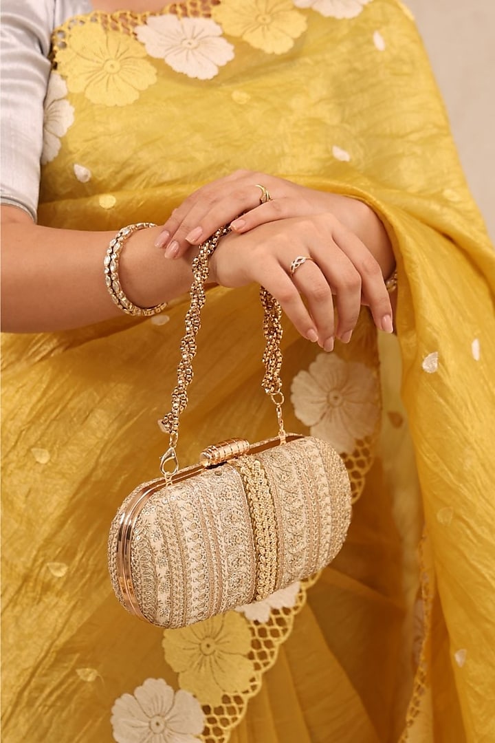 Gold Poly Silk Embroidered Clutch by AMYRA