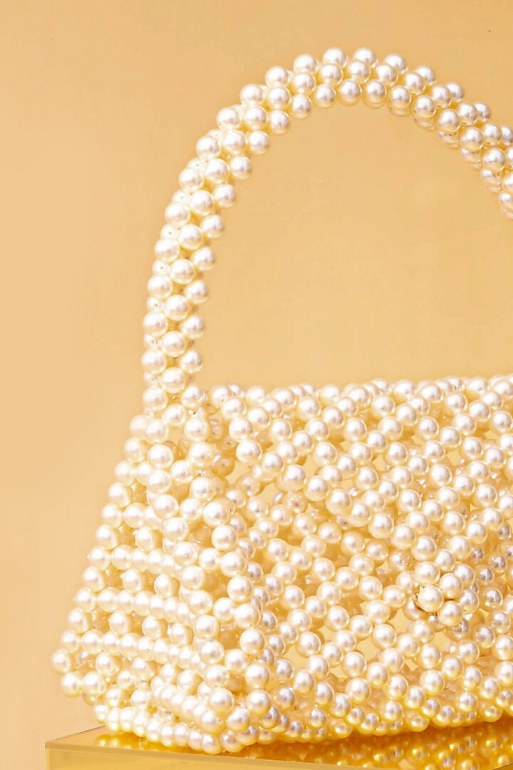 Off-White Pearl Triangle Handbag by AMYRA at Pernia's Pop Up Shop