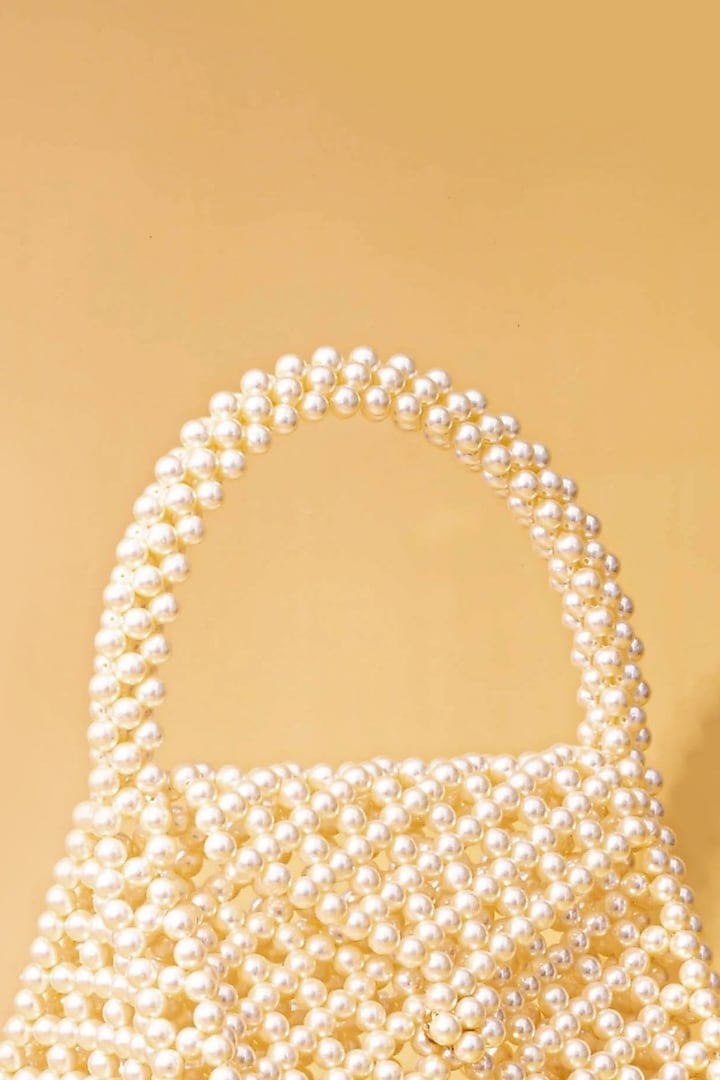 Off-White Pearl Triangle Handbag by AMYRA at Pernia's Pop Up Shop