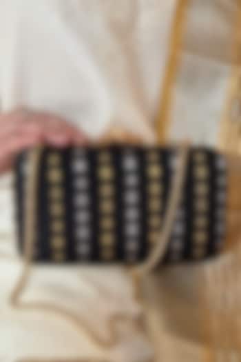 Black Pure Kanchi Silk Zari Boota Work Clutch by AMYRA at Pernia's Pop Up Shop