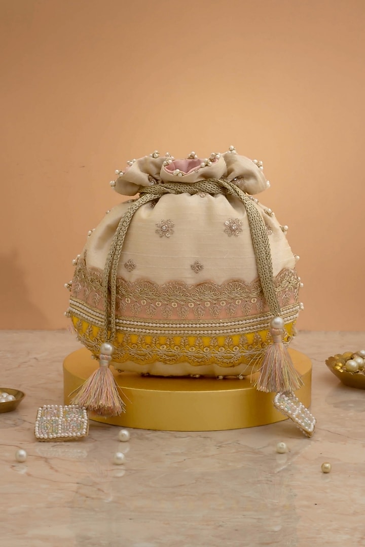 Pink & Yellow Poly Silk Lace Embroidered Potli by AMYRA at Pernia's Pop Up Shop