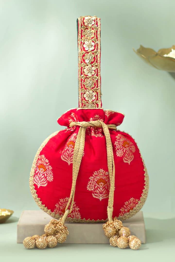 Red Handwoven Raw Silk Sequins Embellished Potli by AMYRA at Pernia's Pop Up Shop