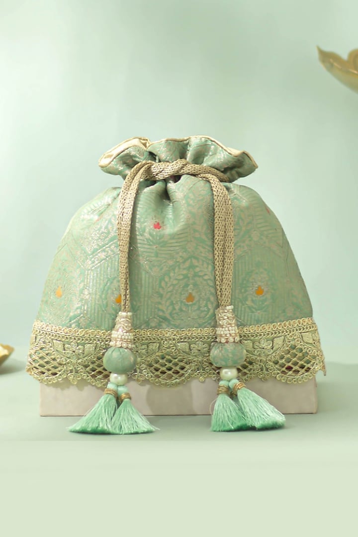 Pastel Green Katan Silk Woven Potli by AMYRA at Pernia's Pop Up Shop