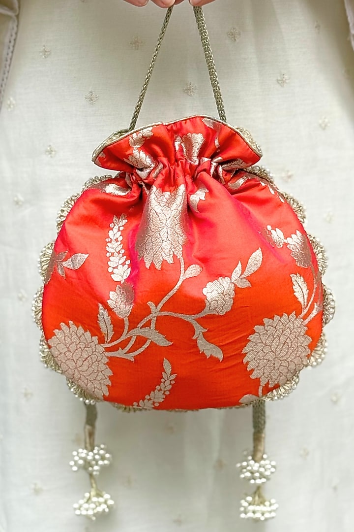 Orange Pure Banarasi Silk Potli by AMYRA at Pernia's Pop Up Shop