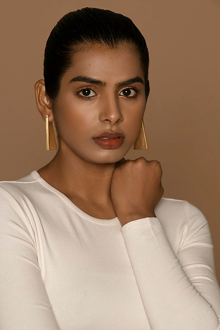 Gold Finish Dangler Earrings In Brass by Ambar House at Pernia's Pop Up Shop