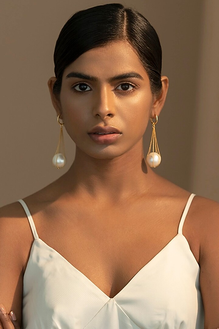 Gold Finish Pearl Dangler Earrings In Sterling Silver by Ambar House at Pernia's Pop Up Shop
