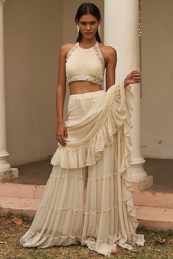 Ivory Metallic Yarn Pre-Draped Ruffled Sharara Saree Set by AMRTA By Guneet Kondal at Pernia's Pop Up Shop