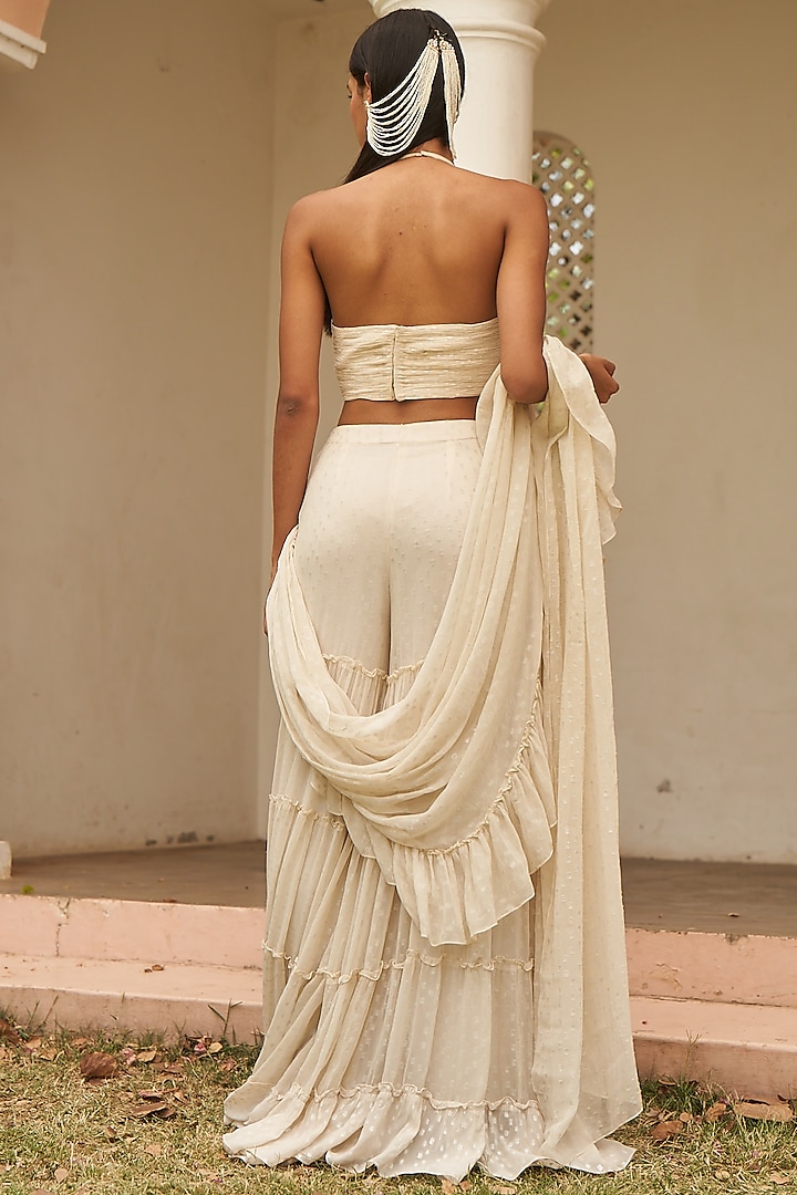 Ivory Metallic Yarn Pre-Draped Ruffled Sharara Party Wear Saree Set by AMRTA By Guneet Kondal at Pernia's Pop Up Shop