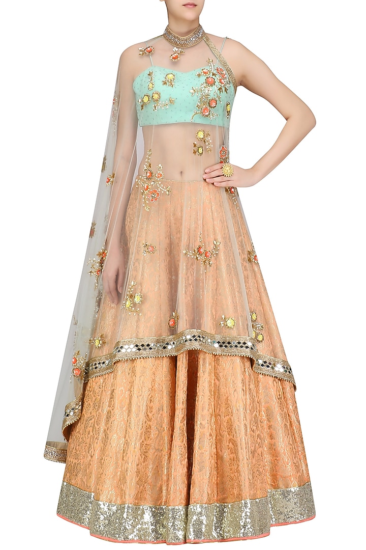 Orange handwoven brocade lehenga with blue bustier and floral work cape available only at Pernia's Pop Up Shop.