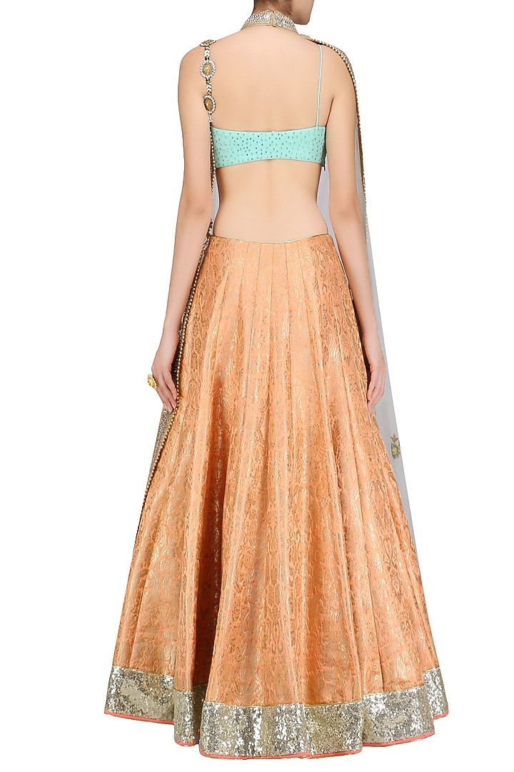 Orange handwoven brocade lehenga with blue bustier and floral work cape available only at Pernia's Pop Up Shop.