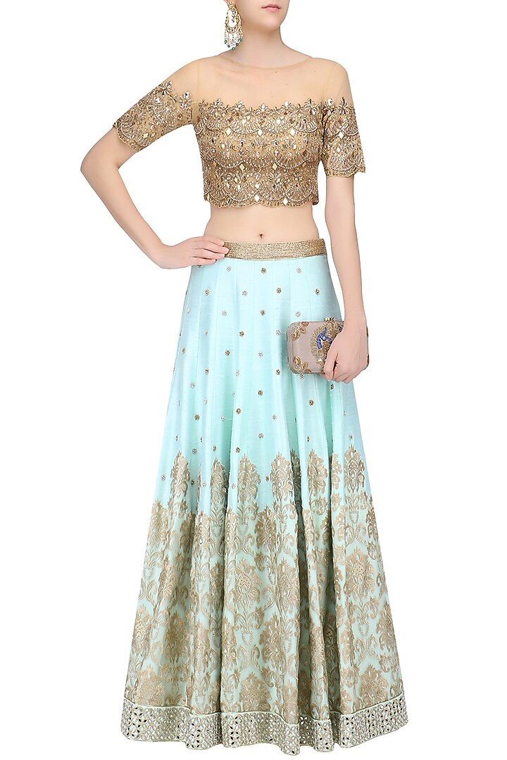 Powder blue embroidered skirt and gold mirror work blouse set available only at Pernia's Pop Up Shop.