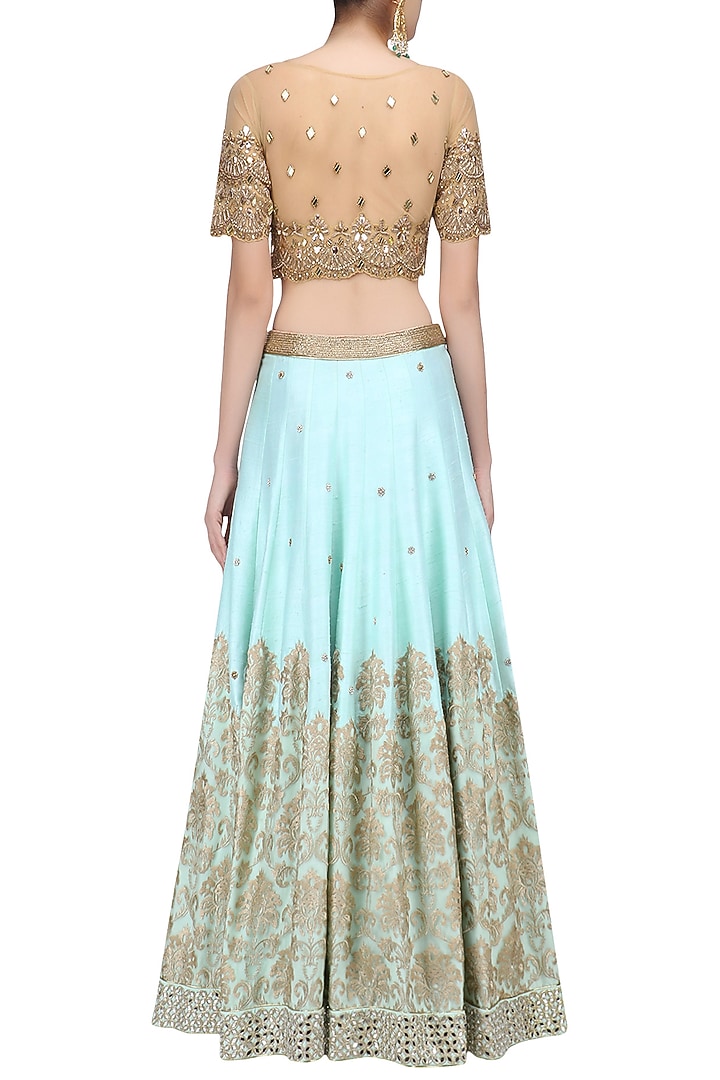 Powder blue embroidered skirt and gold mirror work blouse set available only at Pernia's Pop Up Shop.