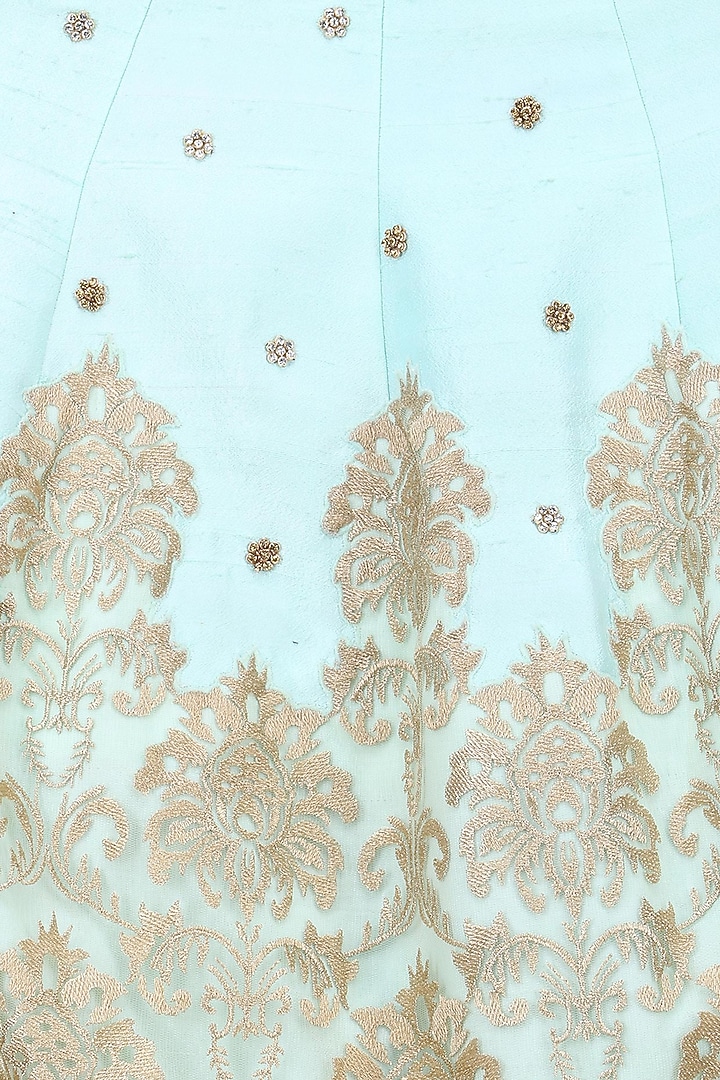 Powder blue embroidered skirt and gold mirror work blouse set available only at Pernia's Pop Up Shop.