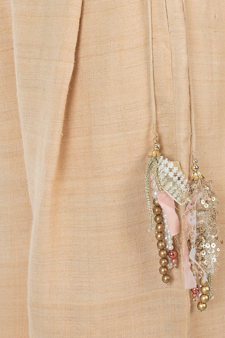 Peach embellished sheer cut tunic with gold palazzo pants available only at Pernia's Pop Up Shop.