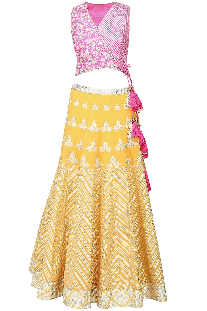Yellow gota patti work lehenga and bright pink blouse set by Amrita Thakur