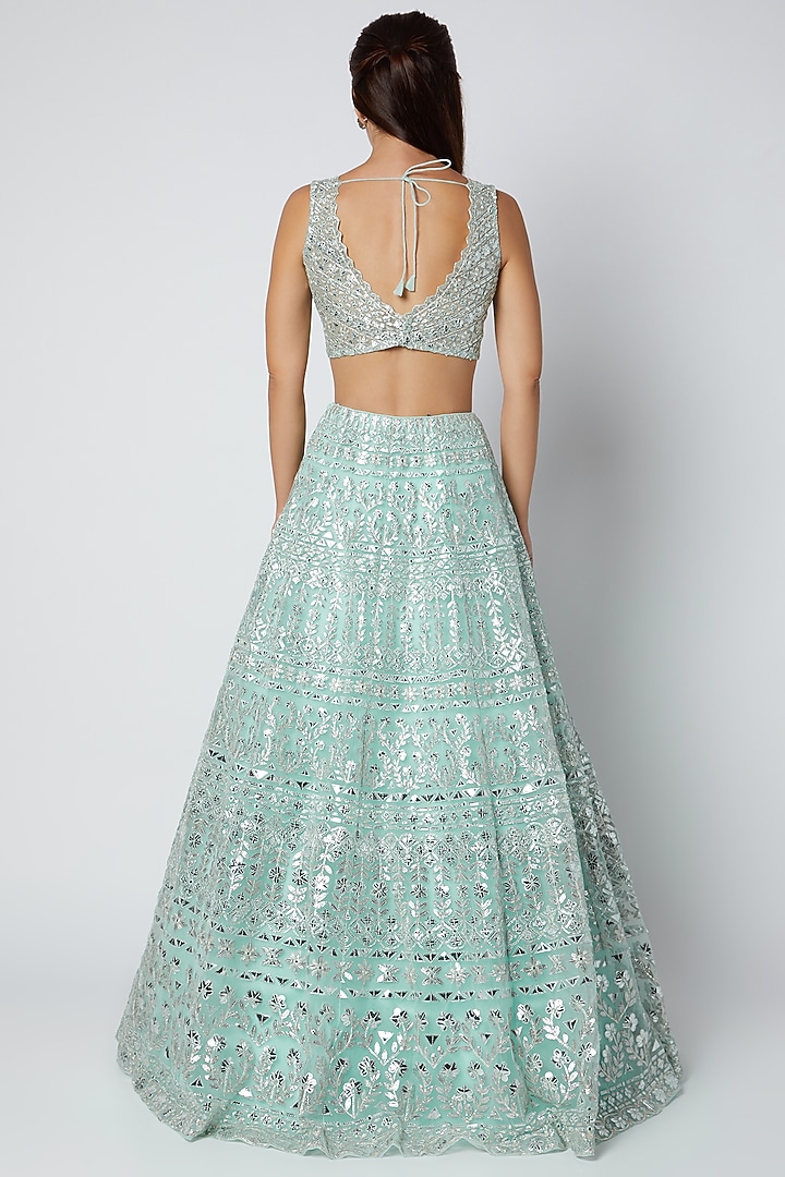Turquoise Net Foil Applique & Mirror Embroidered Bridal Lehenga Set by Aneesh Agarwaal at Pernia's Pop Up Shop