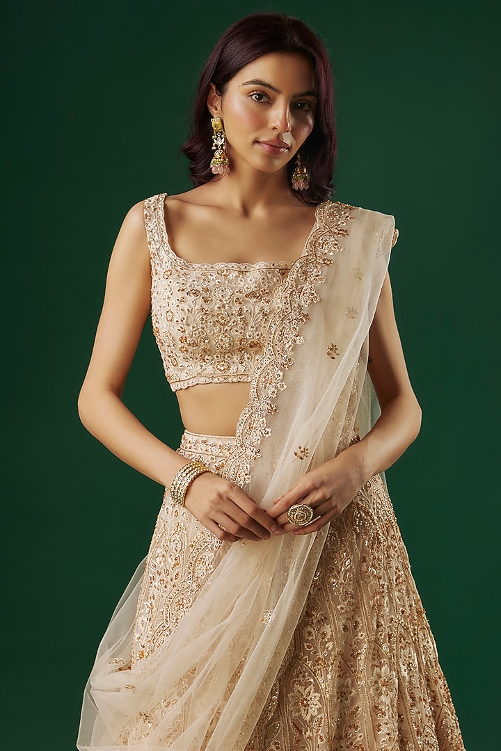 Ivory Tulle Sequins Embroidered Bridal Lehenga Set by Aneesh Agarwaal at Pernia's Pop Up Shop