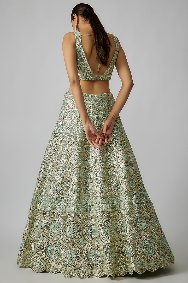 Green Net Foil Applique Embroidered Bridal Lehenga Set by Aneesh Agarwaal at Pernia's Pop Up Shop