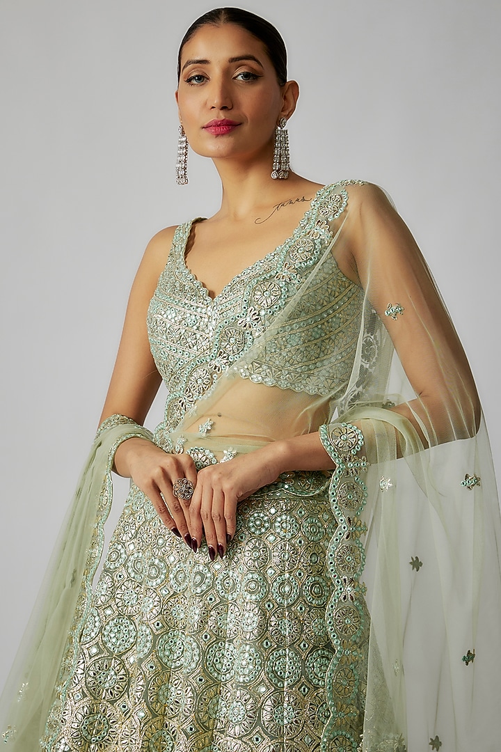 Green Net Foil Applique Embroidered Bridal Lehenga Set by Aneesh Agarwaal at Pernia's Pop Up Shop