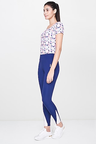 White Printed Top With Blue Leggings by AND